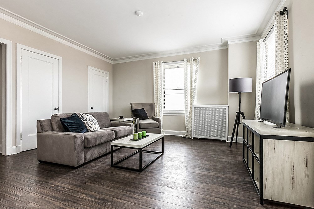 a living room with a couch and a tv