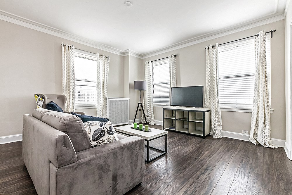 a living room with a couch and a tv