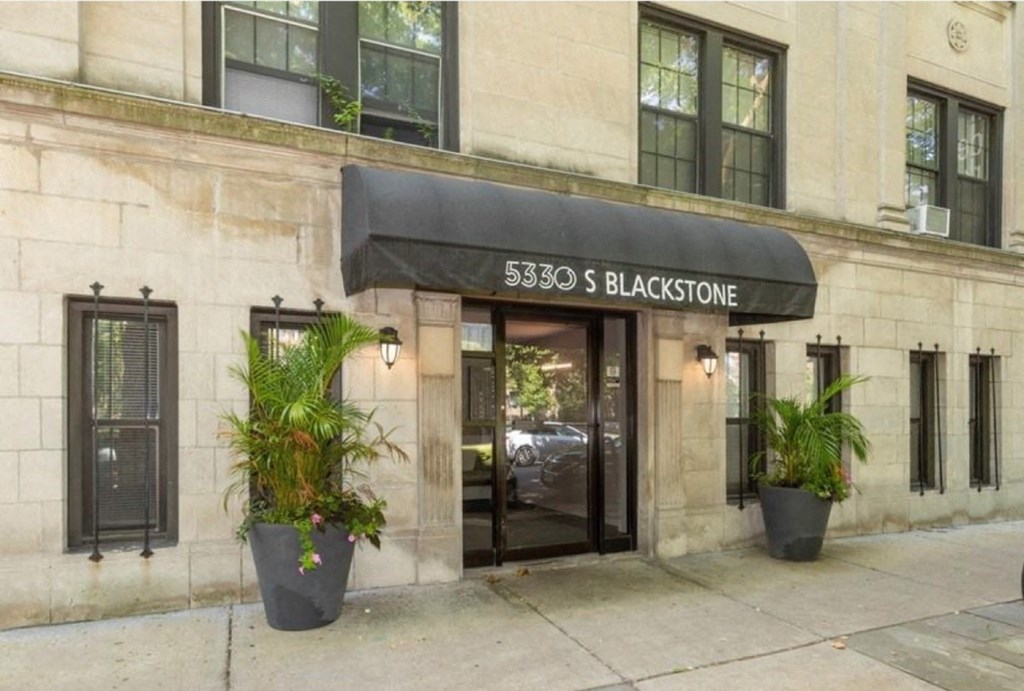 the facade of a building with a revolving door