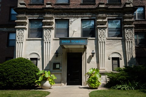 the front of a building with a pass toilets sign