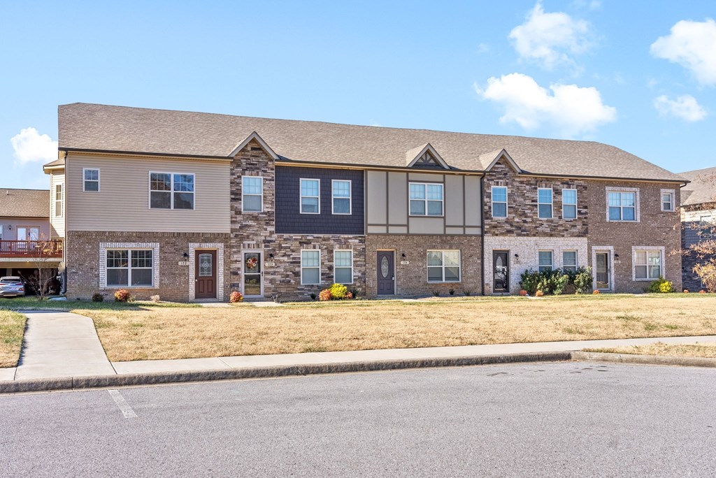 a large house with a street in front of it