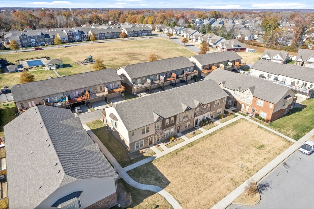 an aerial view of a group of houses in a neighborhood