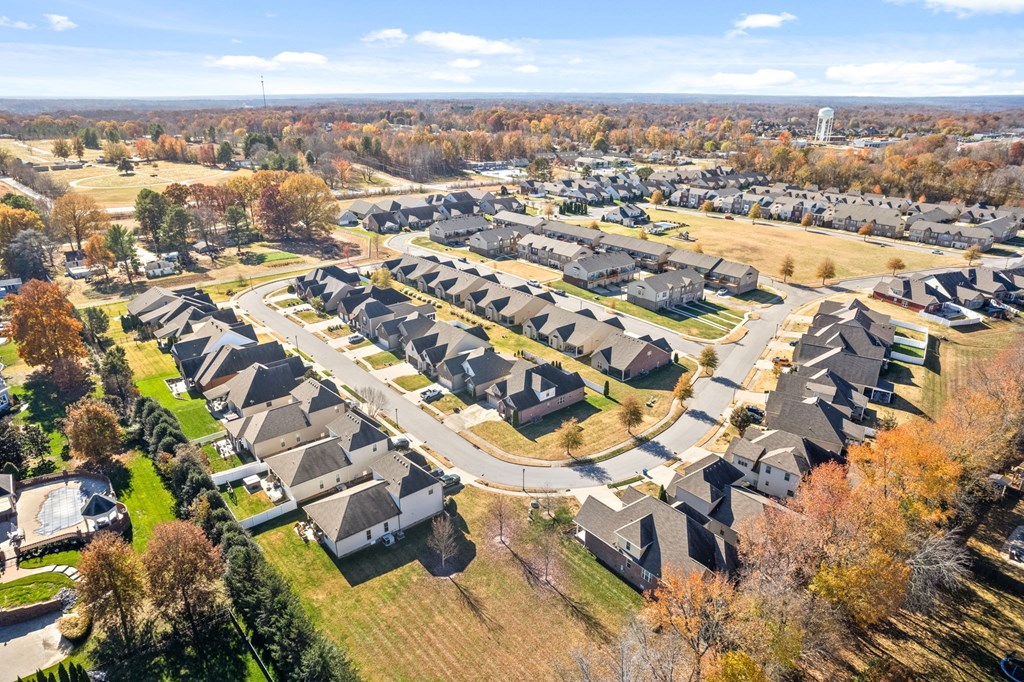 an aerial view of a neighborhood with rows of houses