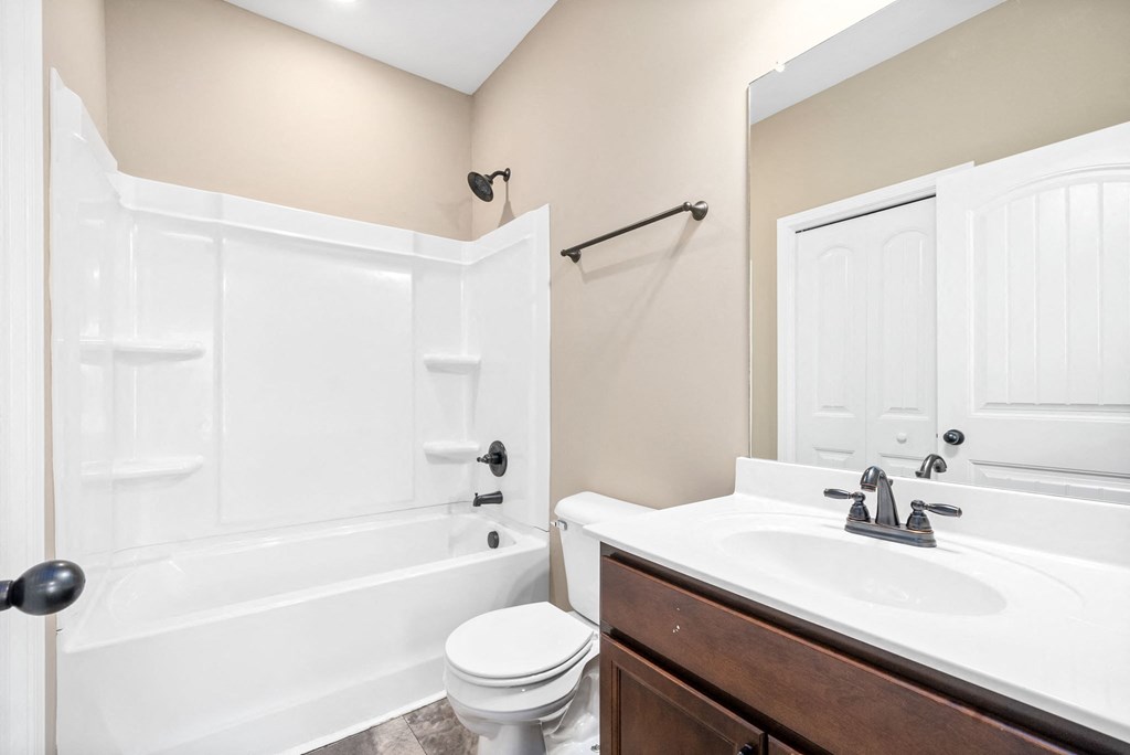 a bathroom with a sink toilet and a bath tub