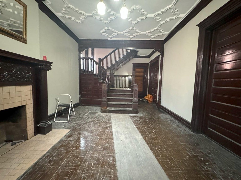 a view of the lobby of a house with a staircase
