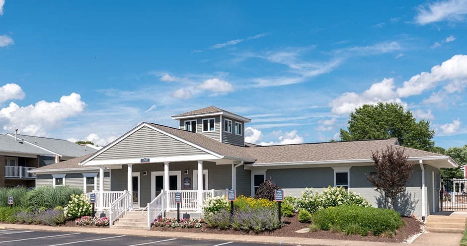 clubhouse and leasing office building with sidewalk