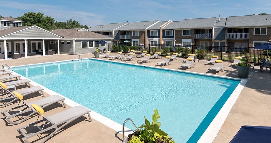 outdoor swimming pool with lounge chairs