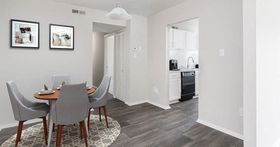 hallway inside apartment showing layout of kitchen and dining room