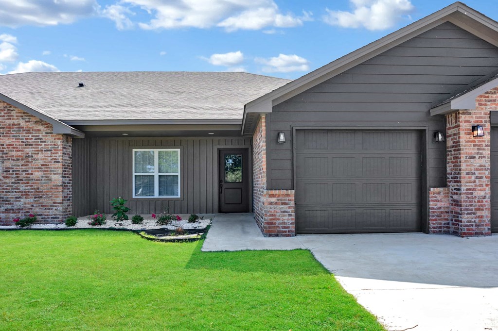 a house with a driveway and a garage door