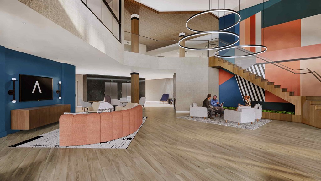 a rendering of a lobby with couches and a staircase