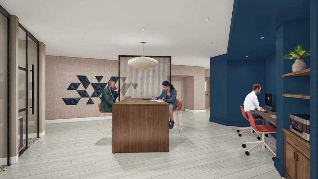 a group of people sitting around a desk in a lobby