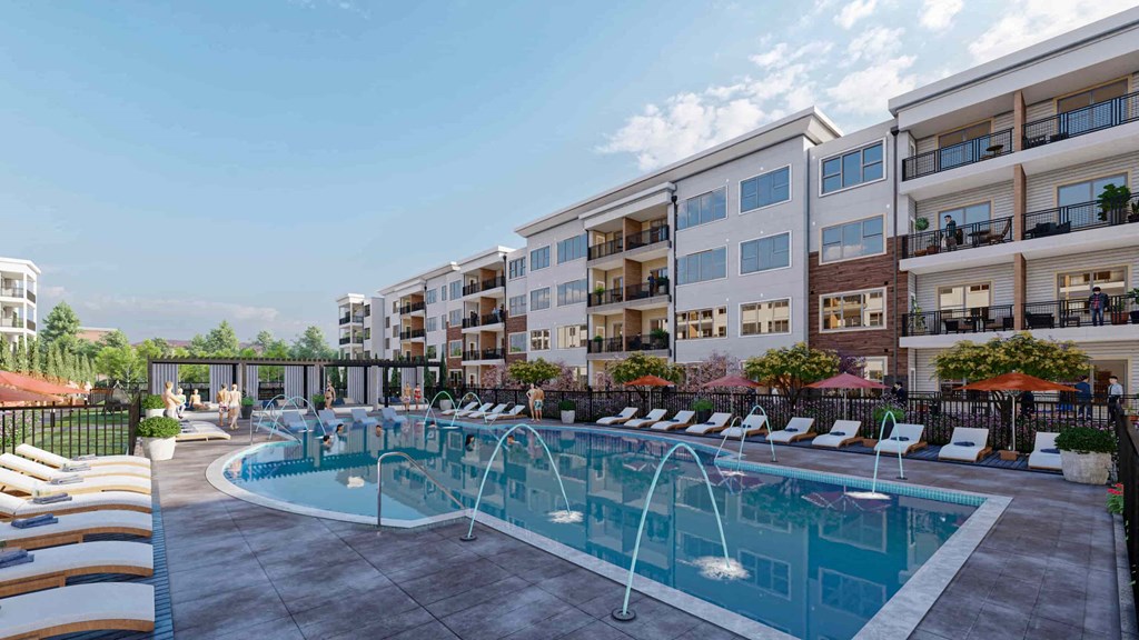a swimming pool in front of an apartment building