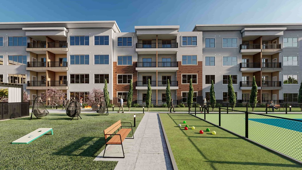 an exterior view of an apartment building with a tennis court
