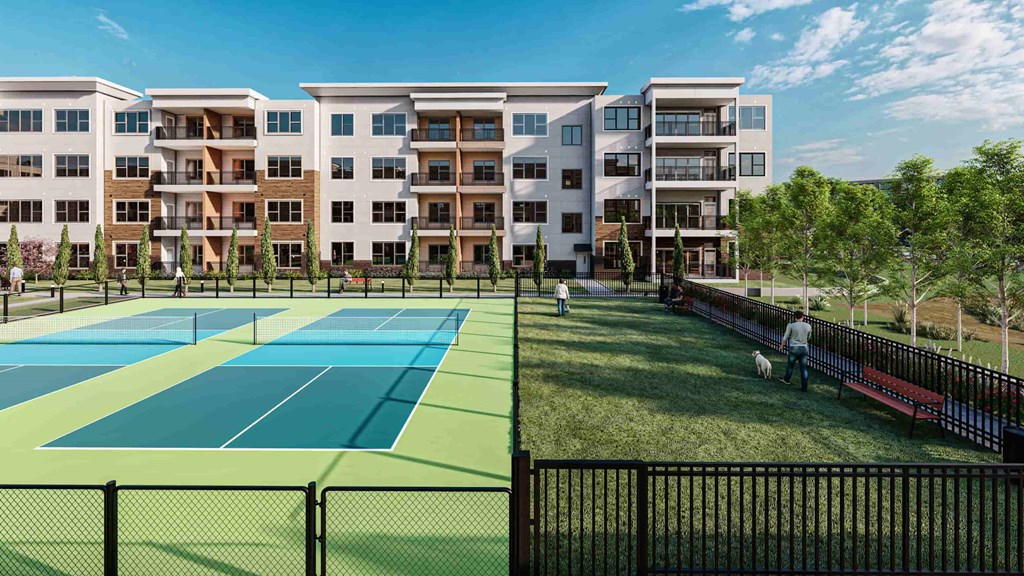 a rendering of a tennis court with apartments in the background