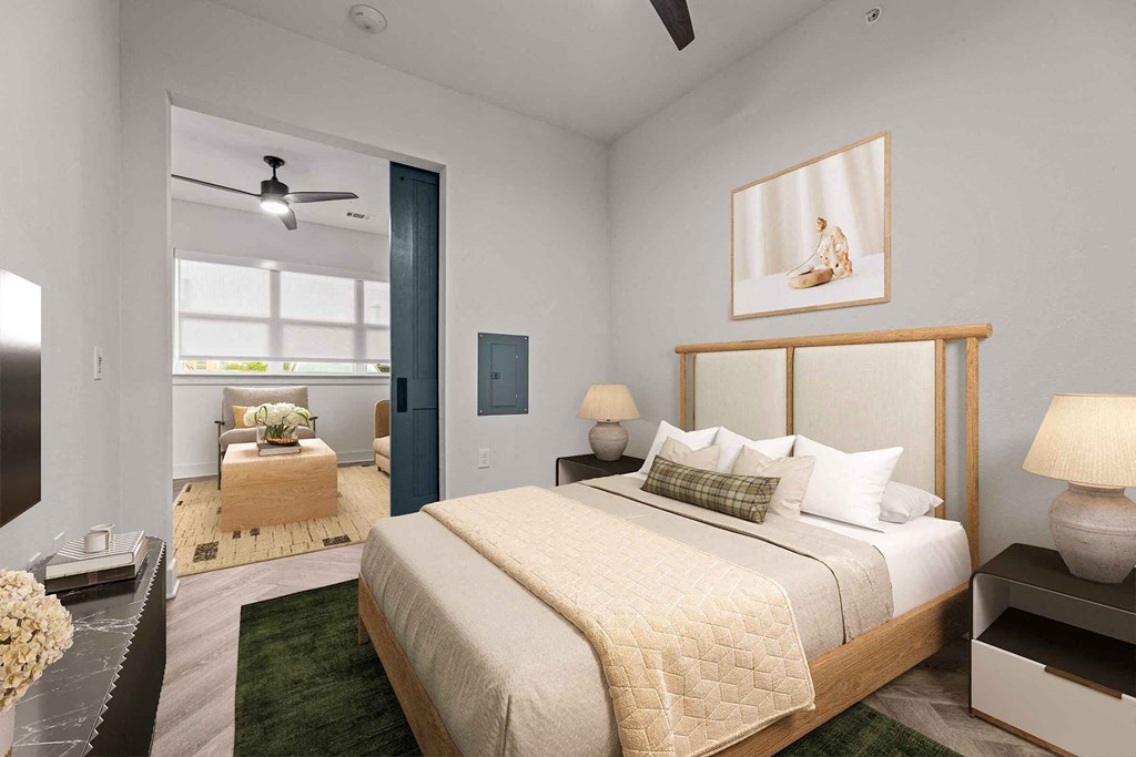 a bedroom with a large bed and a window