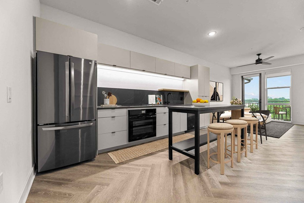 a kitchen with a counter and a refrigerator