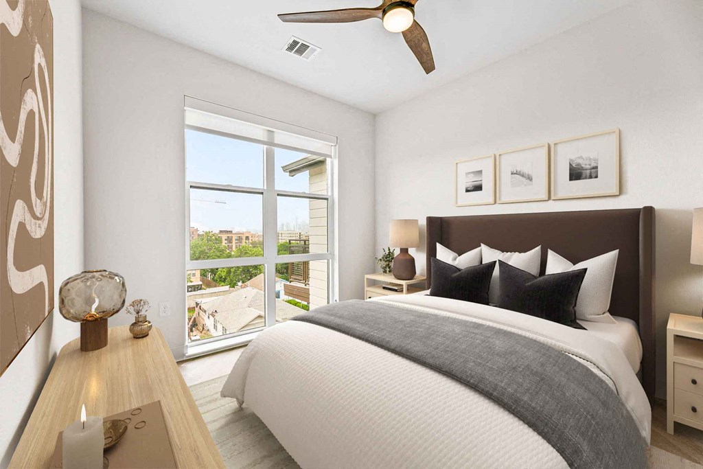 a bedroom with a large bed and a window