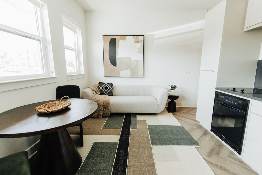 a living room with a couch and a table and a television