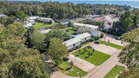 an aerial view of a neighborhood with houses and trees