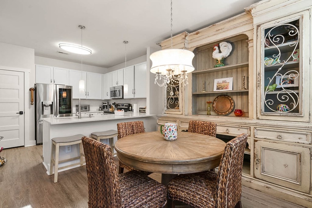 a dining room with a table and chairs