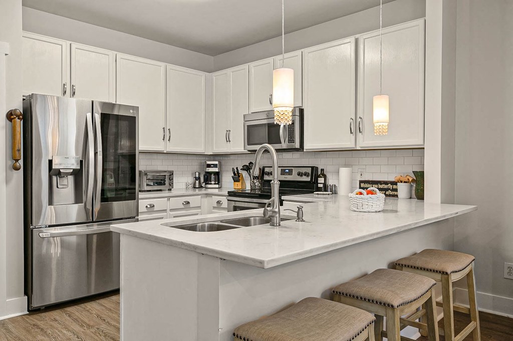 a kitchen with a sink and a counter top