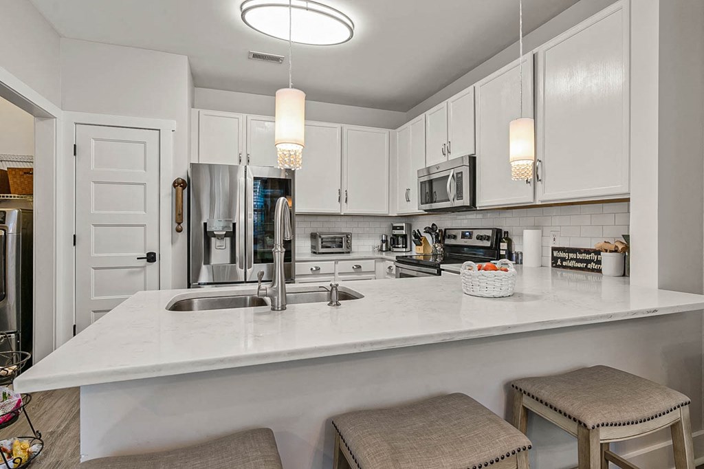 a kitchen with a counter top and a sink