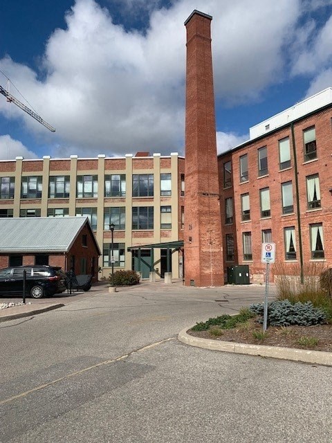 a large brick building with a tall brick tower