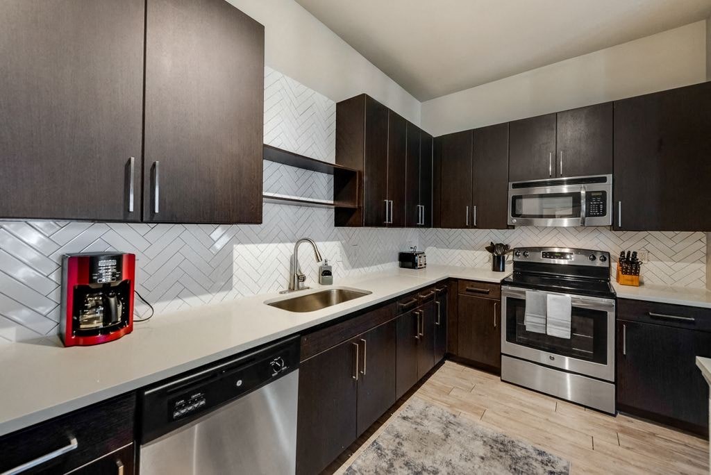 a kitchen with a sink and a stove
