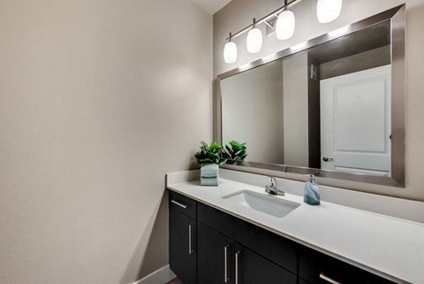 a bathroom with a sink and a mirror