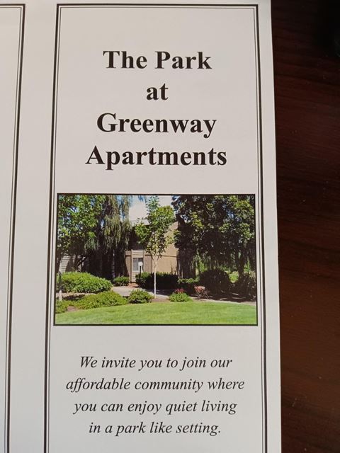 a sign for the park at greenway apartments