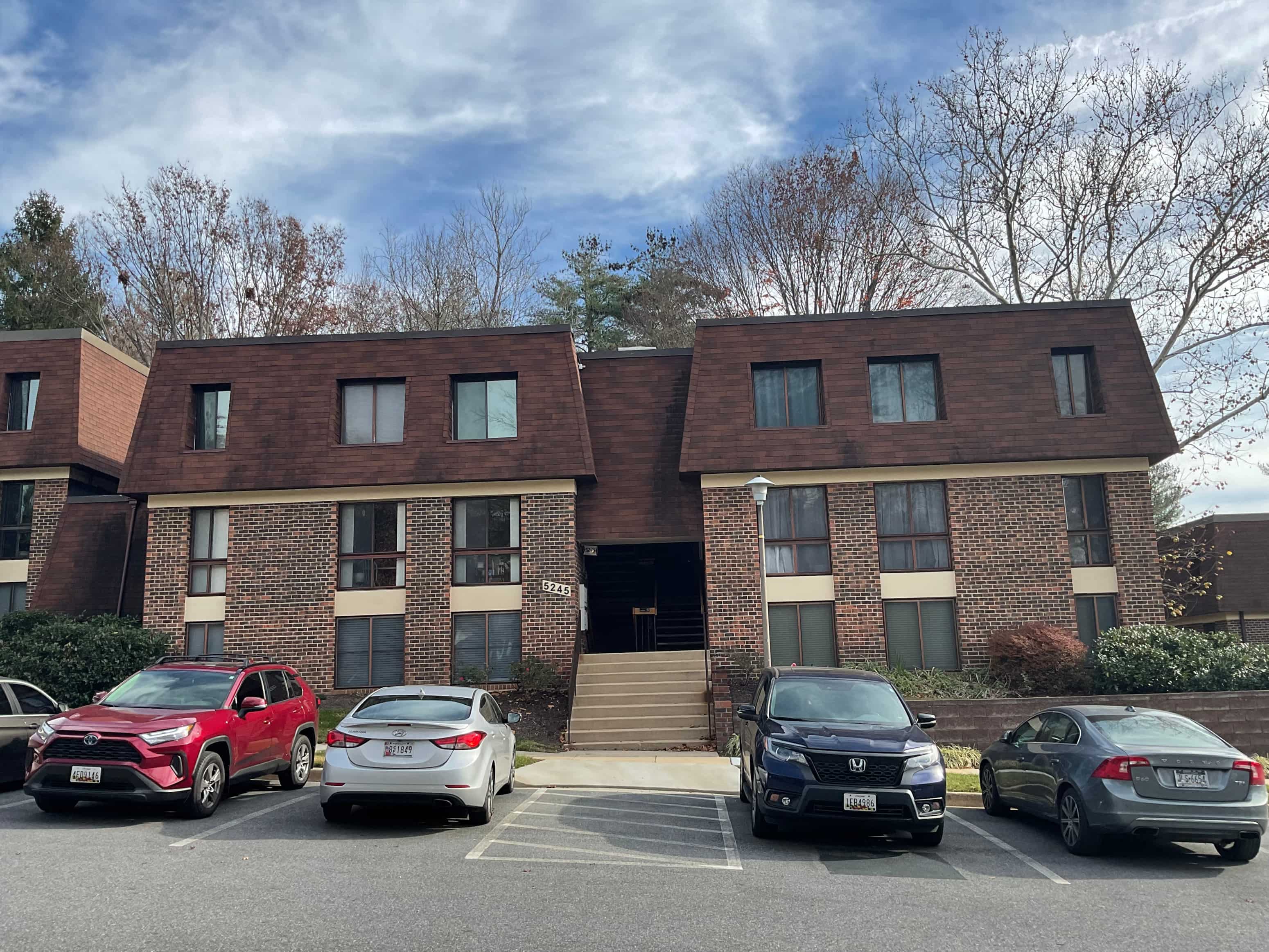 a building with cars parked in front of it