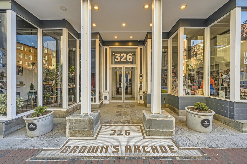The front of a building with the number 326 and the words Brown's Arcade on the ground.