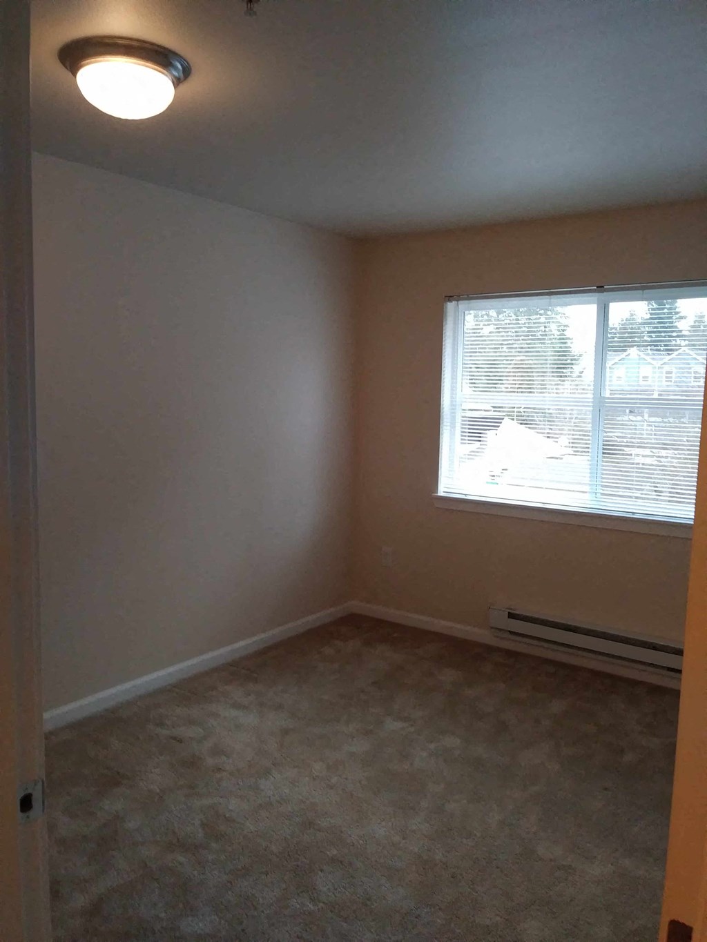 an empty room with a window in it