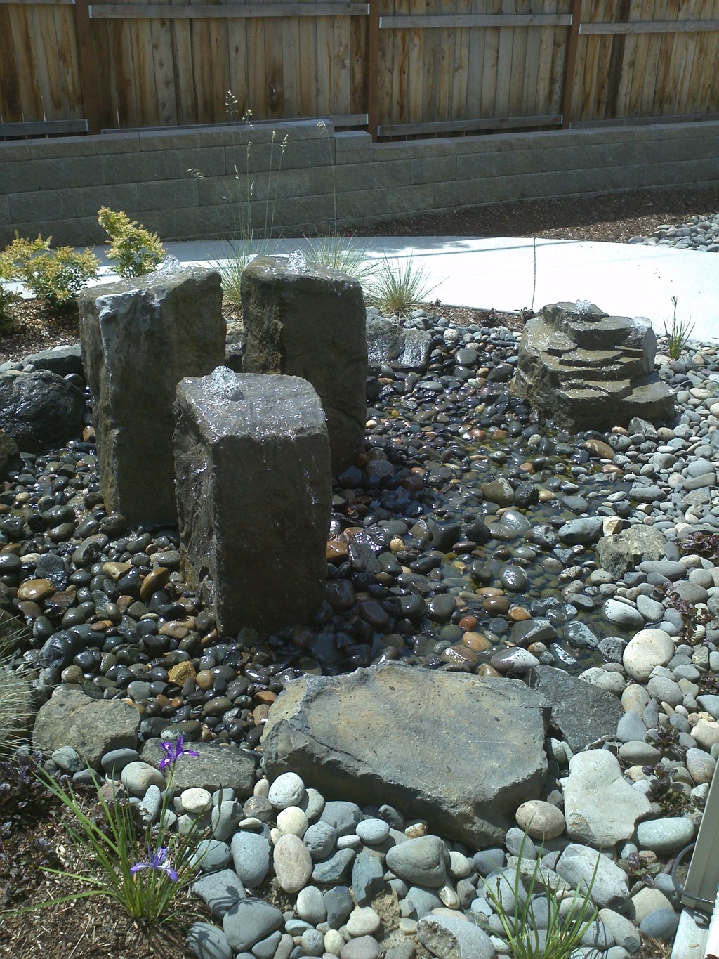 a group of rocks sitting on top of rocks and gravel