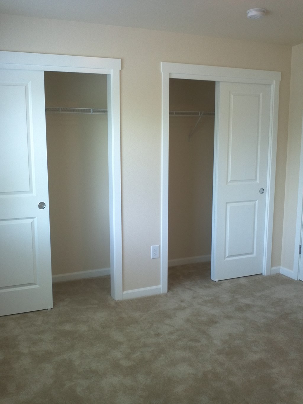 the closet in the master bedroom has two closets and two doors
