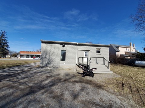 a small house with a motorcycle parked in front of it