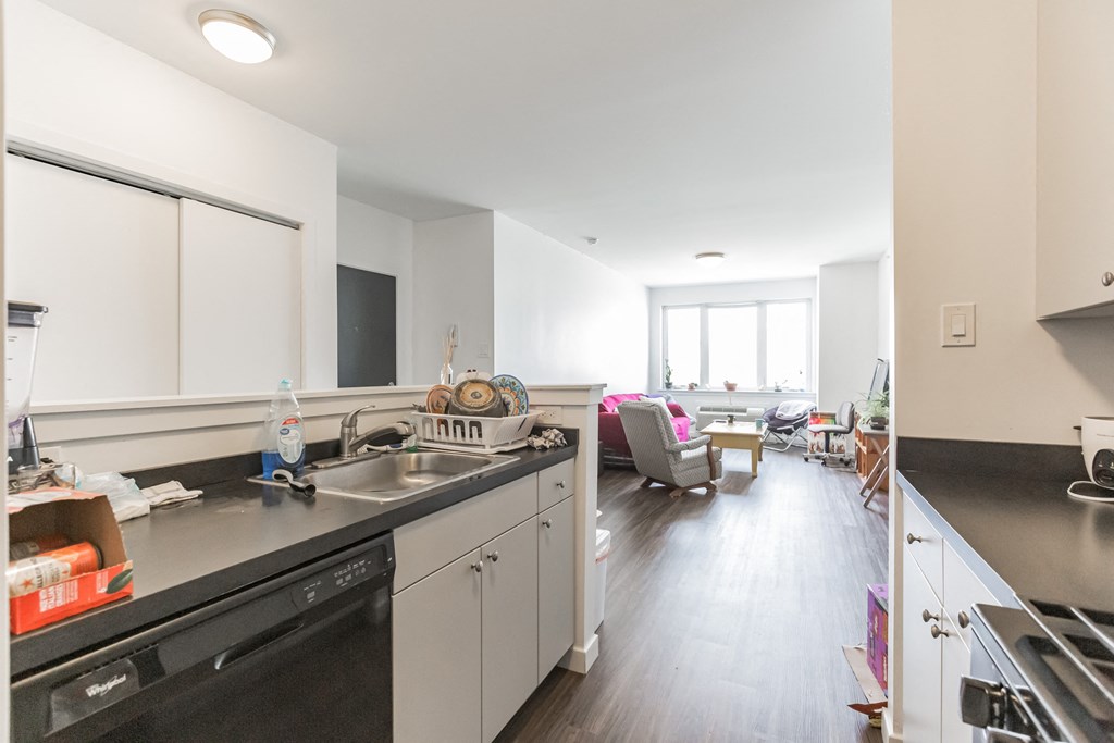 the kitchen and living room of an apartment