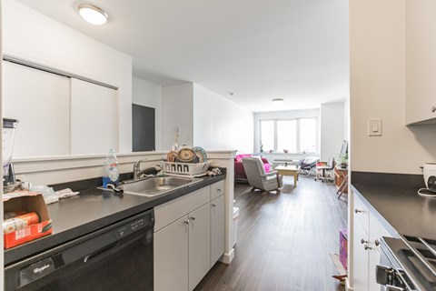 the kitchen and living room of an apartment
