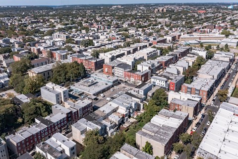 an aerial view of a city with buildings and trees