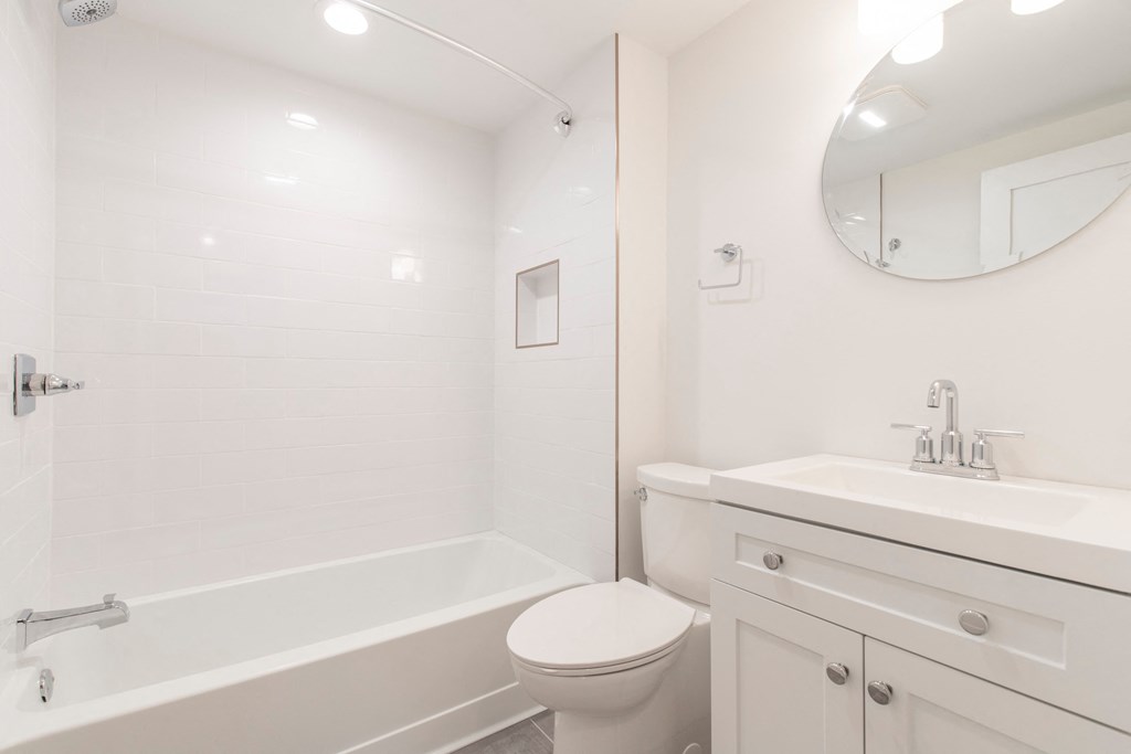 a bathroom with a sink toilet and a shower