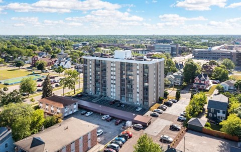 an aerial view of a tall building in a city