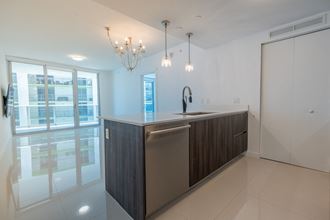 a kitchen with a sink and a counter top in a house