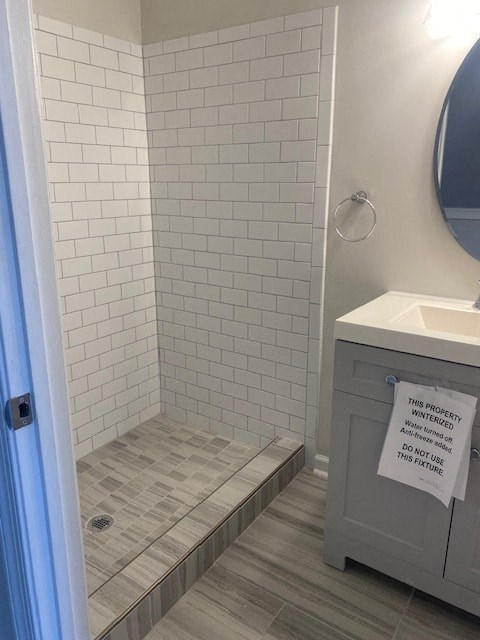 a small bathroom with a shower and a sink