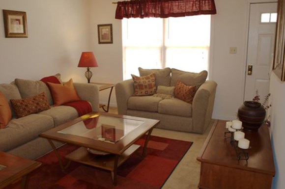 a living room with couches and a coffee table