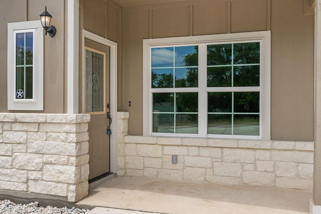 a view of the front porch of a house with windows