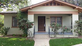 a house with a front porch and a wooden door