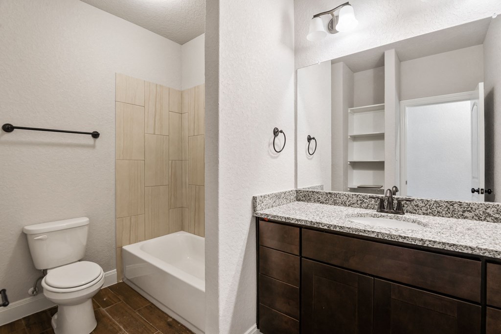 the preserve at ballantyne commons bathroom with toilet sink and tub