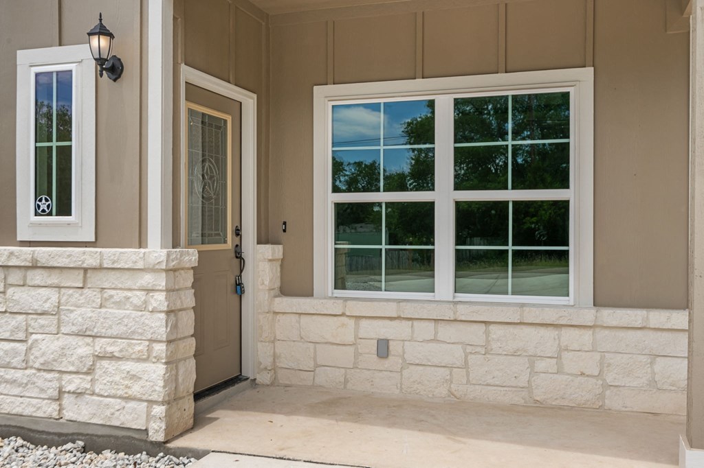 a view of the front porch of a house with windows