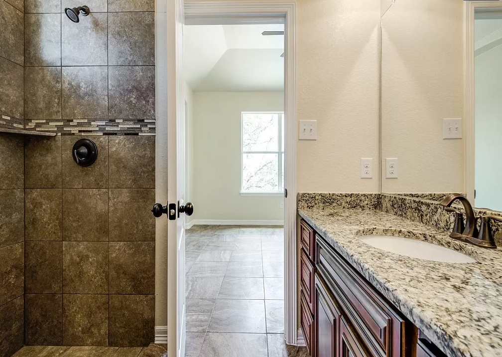 a bathroom with a sink and a shower