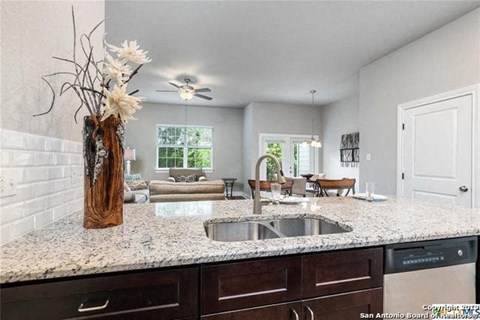a kitchen with a sink and a counter top